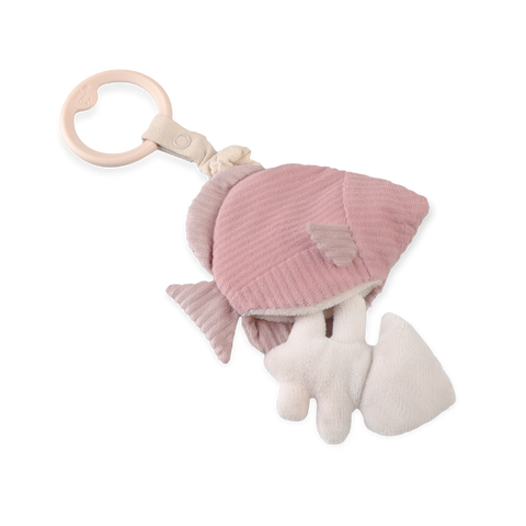 Pink plush fish baby rattle with textured fabrics and wooden ring.