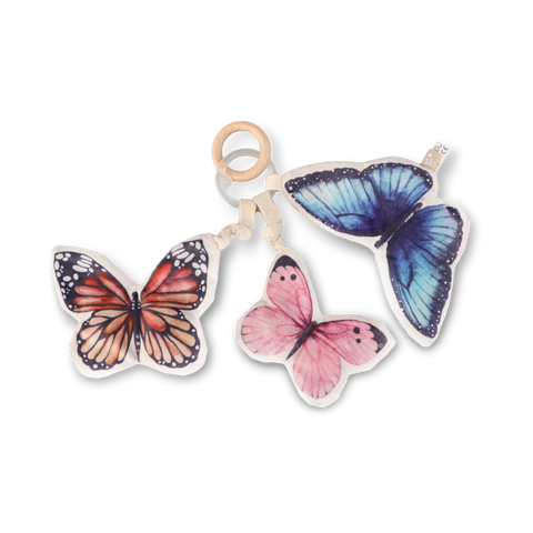Three colorful butterfly toys hang from a wooden ring and strap.