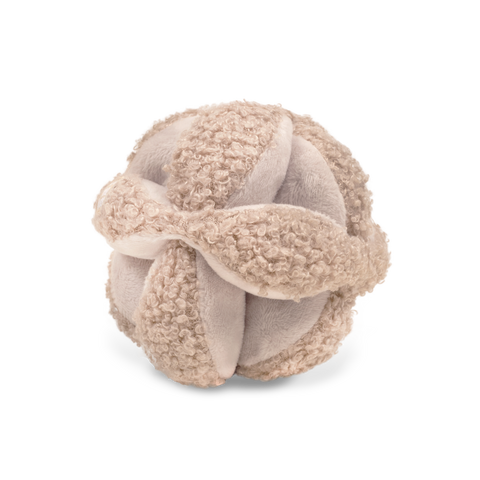Beige plush dog toy forms a textured ball.