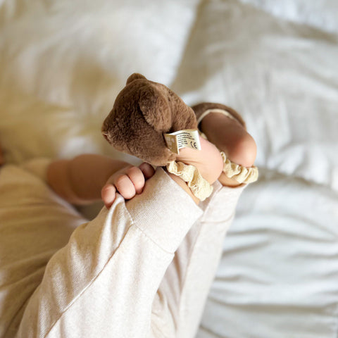 Teddy kicking rattle