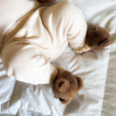 Teddy kicking rattle