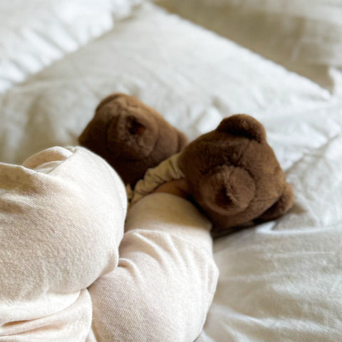 Teddy kicking rattle