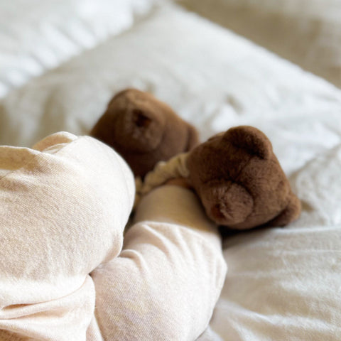 Teddy kicking rattle