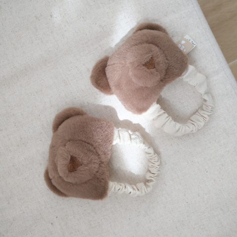Teddy kicking rattle